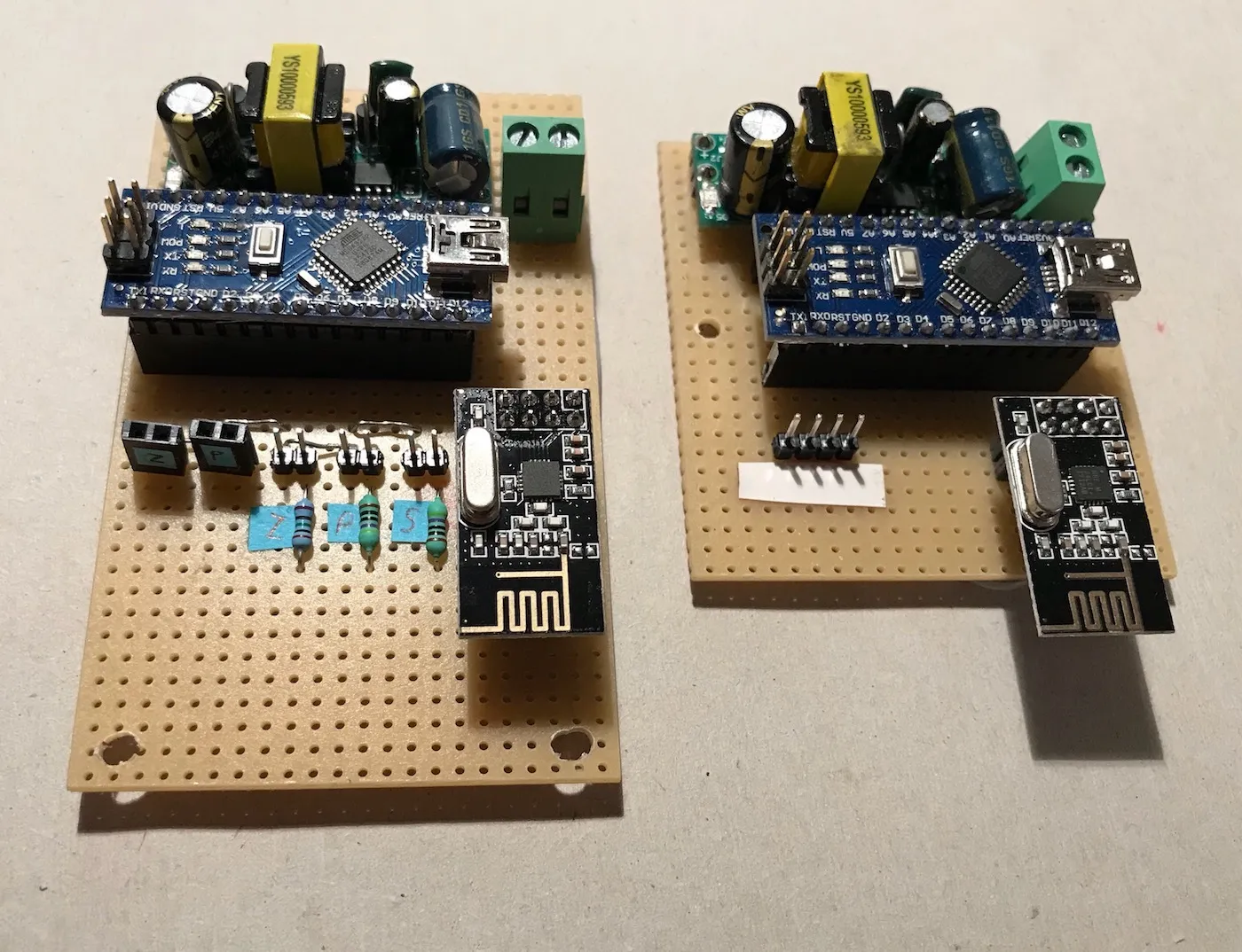 Bare controller and receiver electronics, both featuring a power conversion module, an Arduino and an RF module