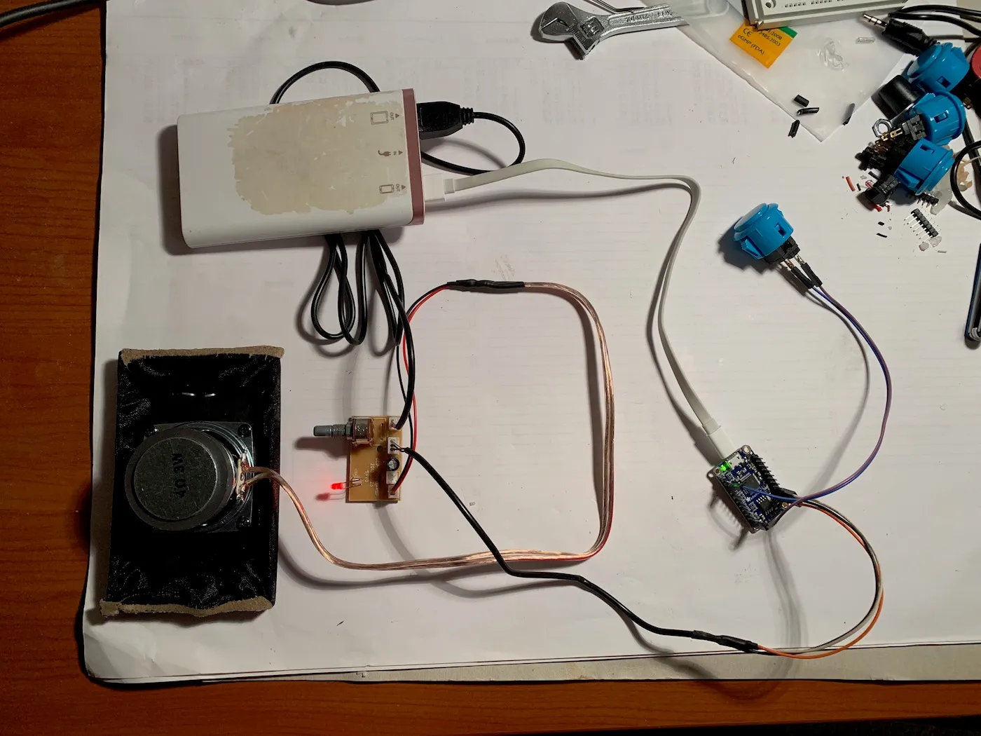 Components during the build, the amplifier board is connected to the Adafruit board and a speaker, powered by a power bank