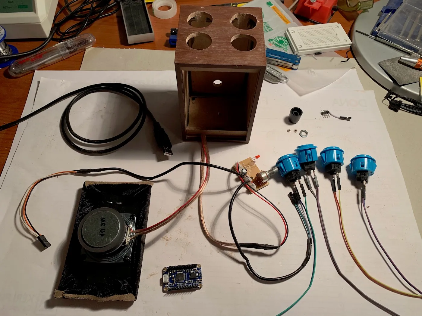 Components during the build, the top of the speaker's box has four holes for the momentary switches