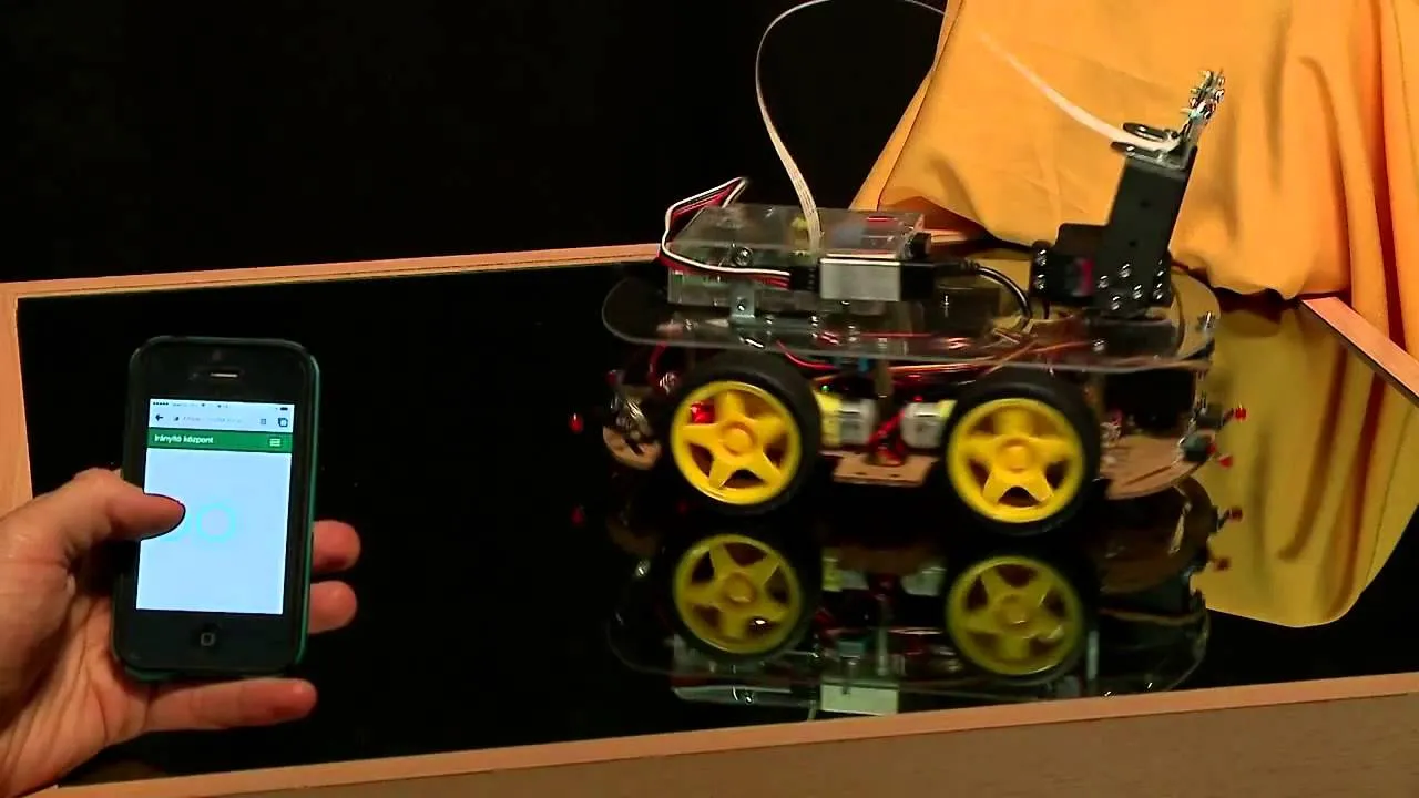 The robot car with its camera arm being controlled from a smartphone