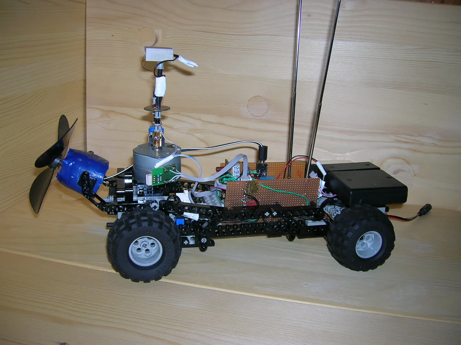 Firefighting robot built from LEGO parts that finds fire by its light and puts it out with a fan, controlled from a computer with MSW Logo