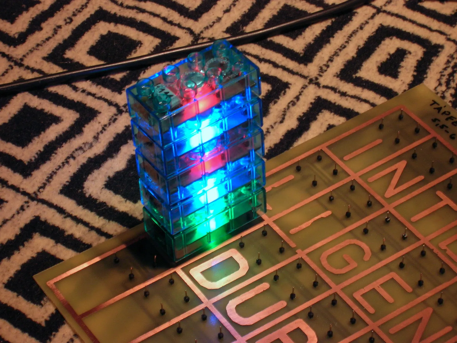 Bricks on top of each other, lit in different colors