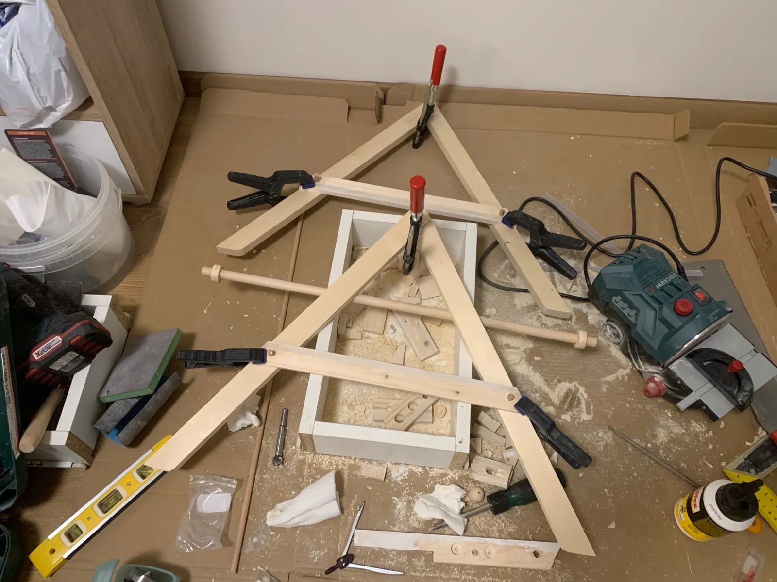 The two A-frame legs clamped while the glue dries