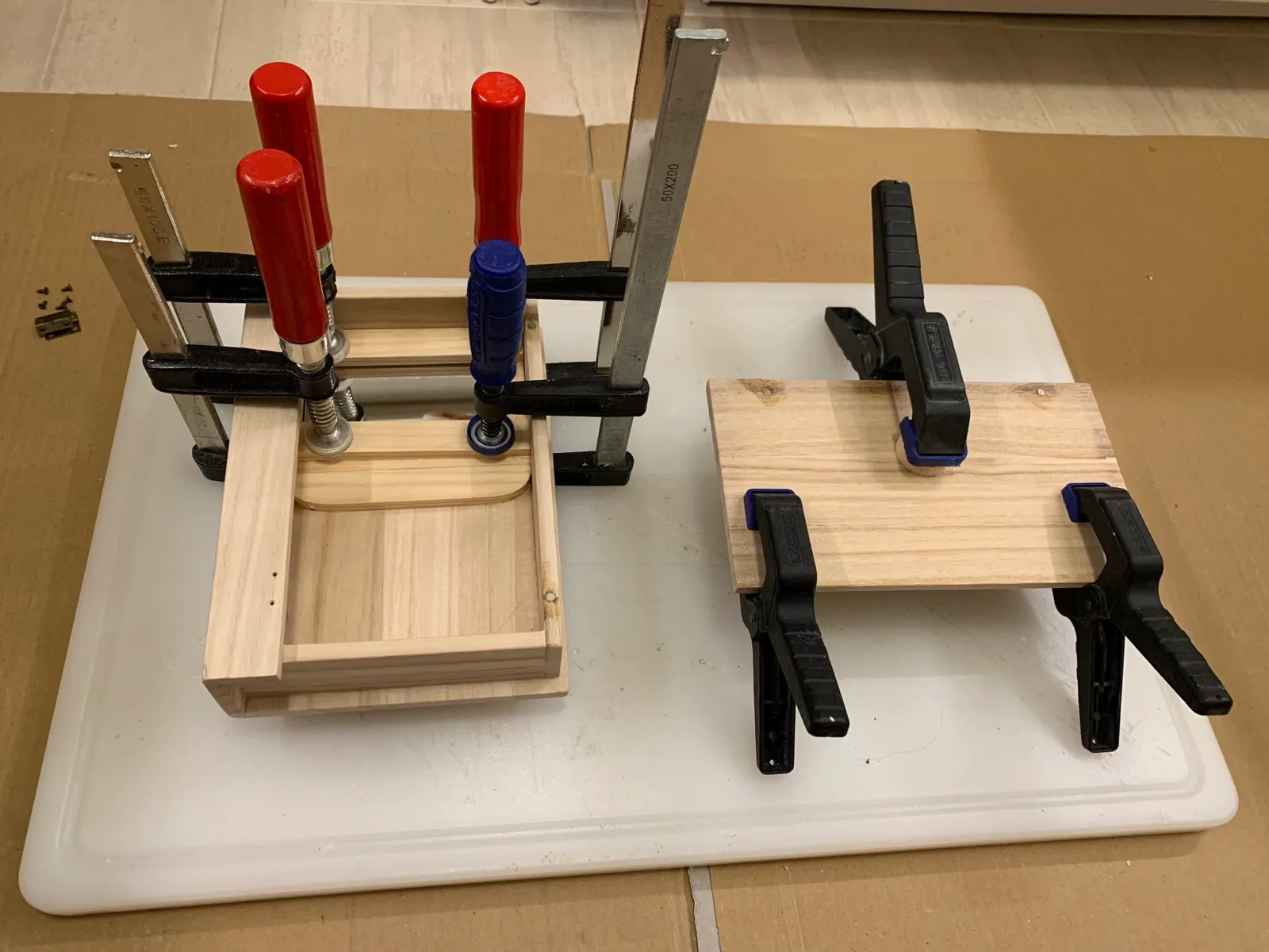 Small doors and boxes glued up in clamps