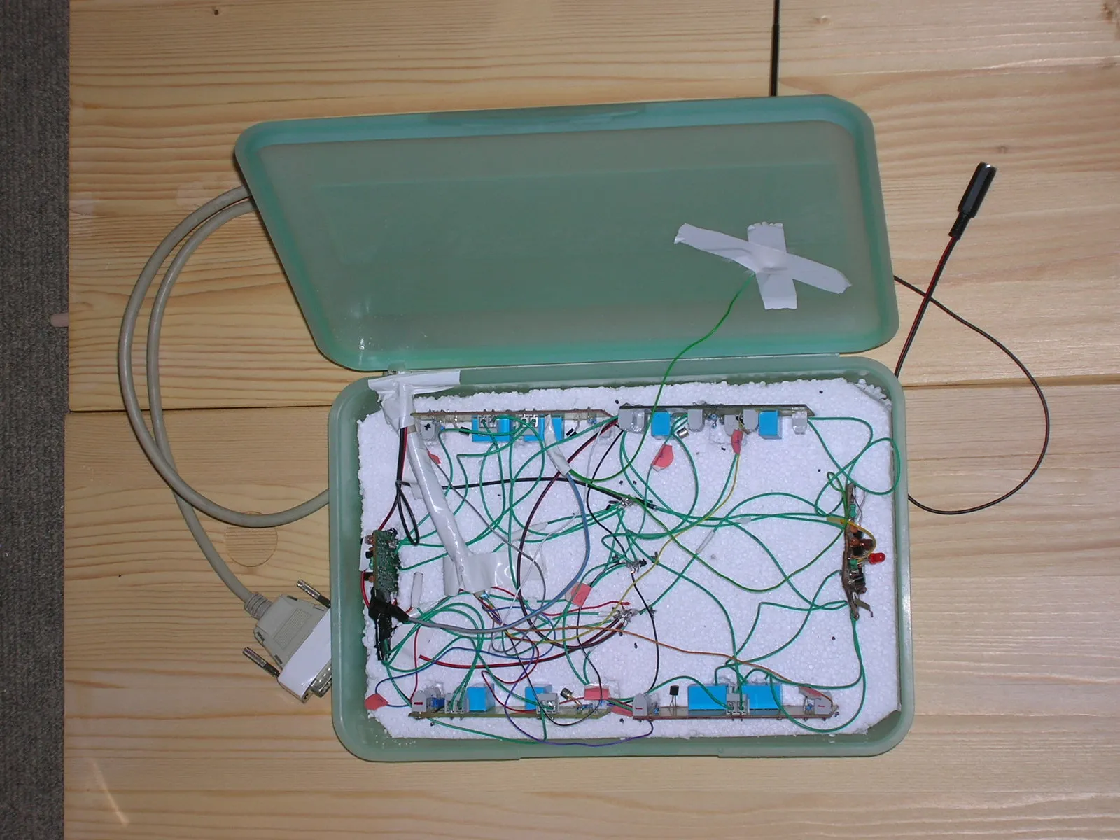 Later version of the control box, custom relay-driven electronics wired point to point that key the RC transmitters from the printer port