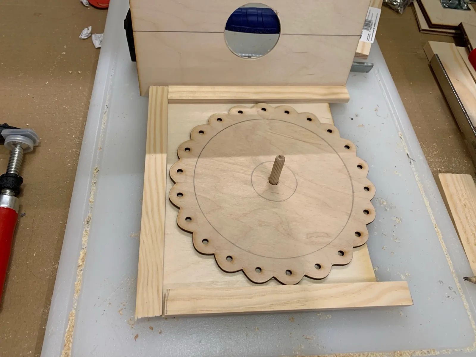 The rotating dial on its axle during assembly