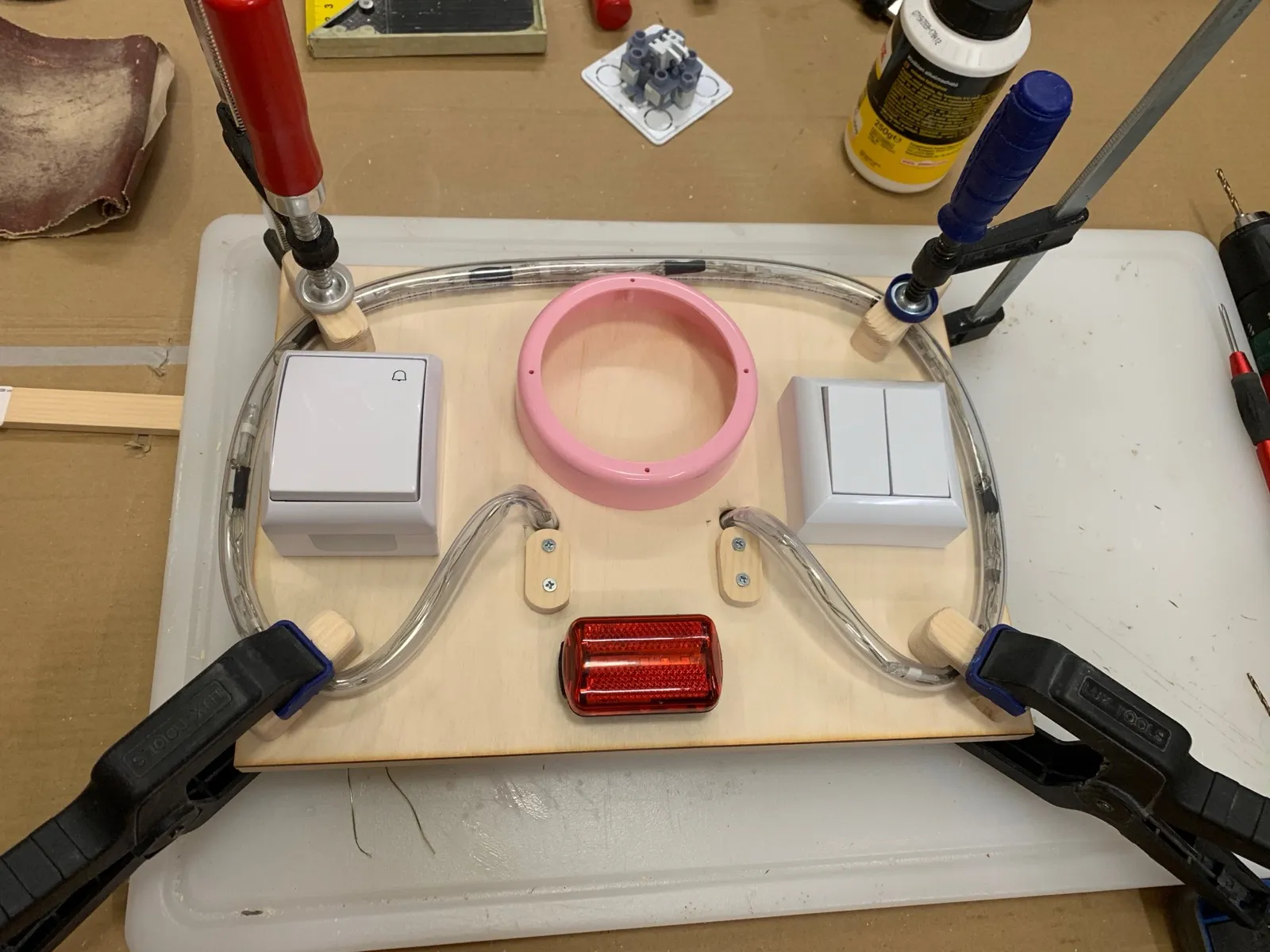 The electronics panel glued up: light switches, bike light and LED strip