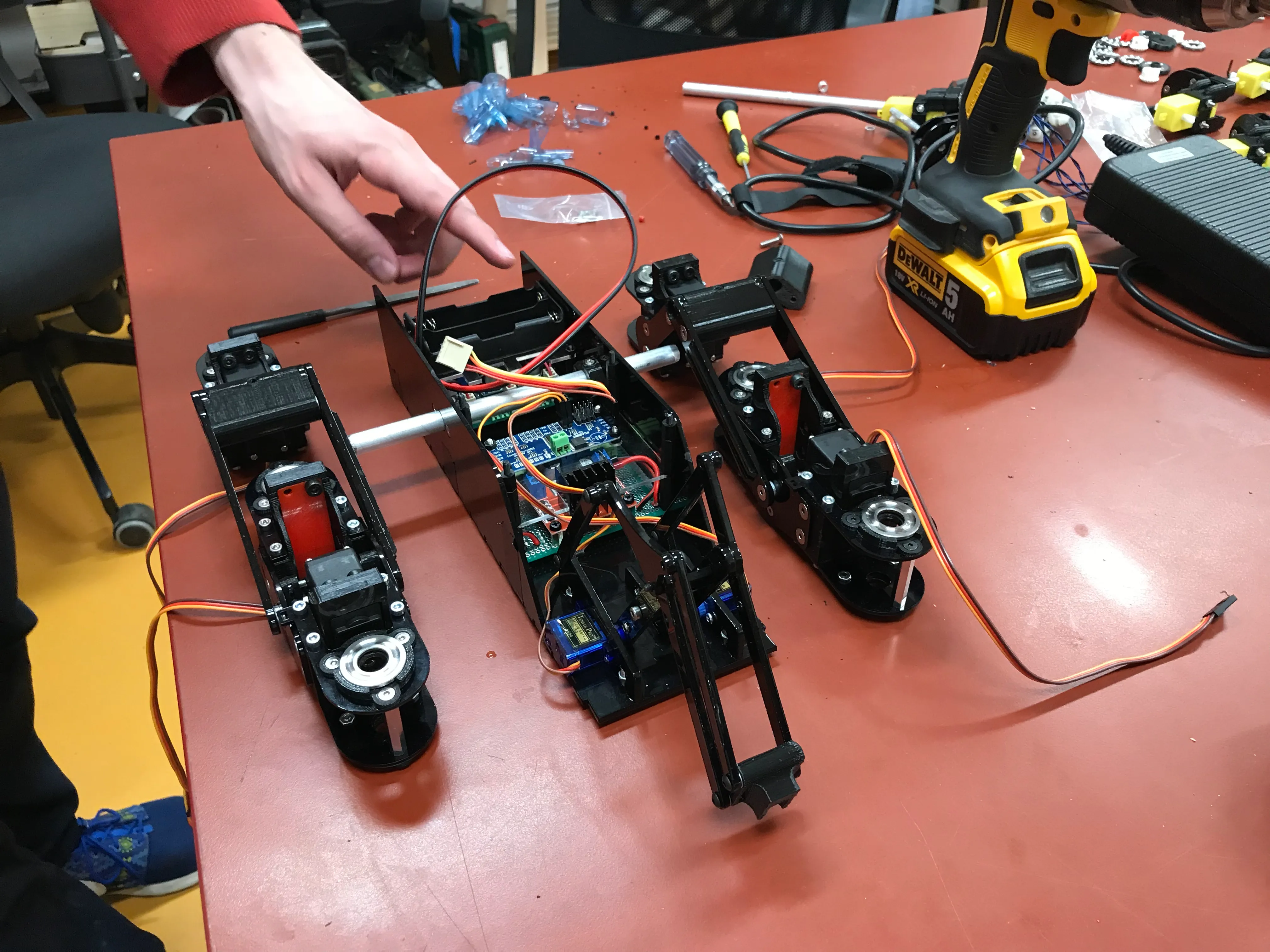 The laser cut chassis and the two suspension assemblies mid-build