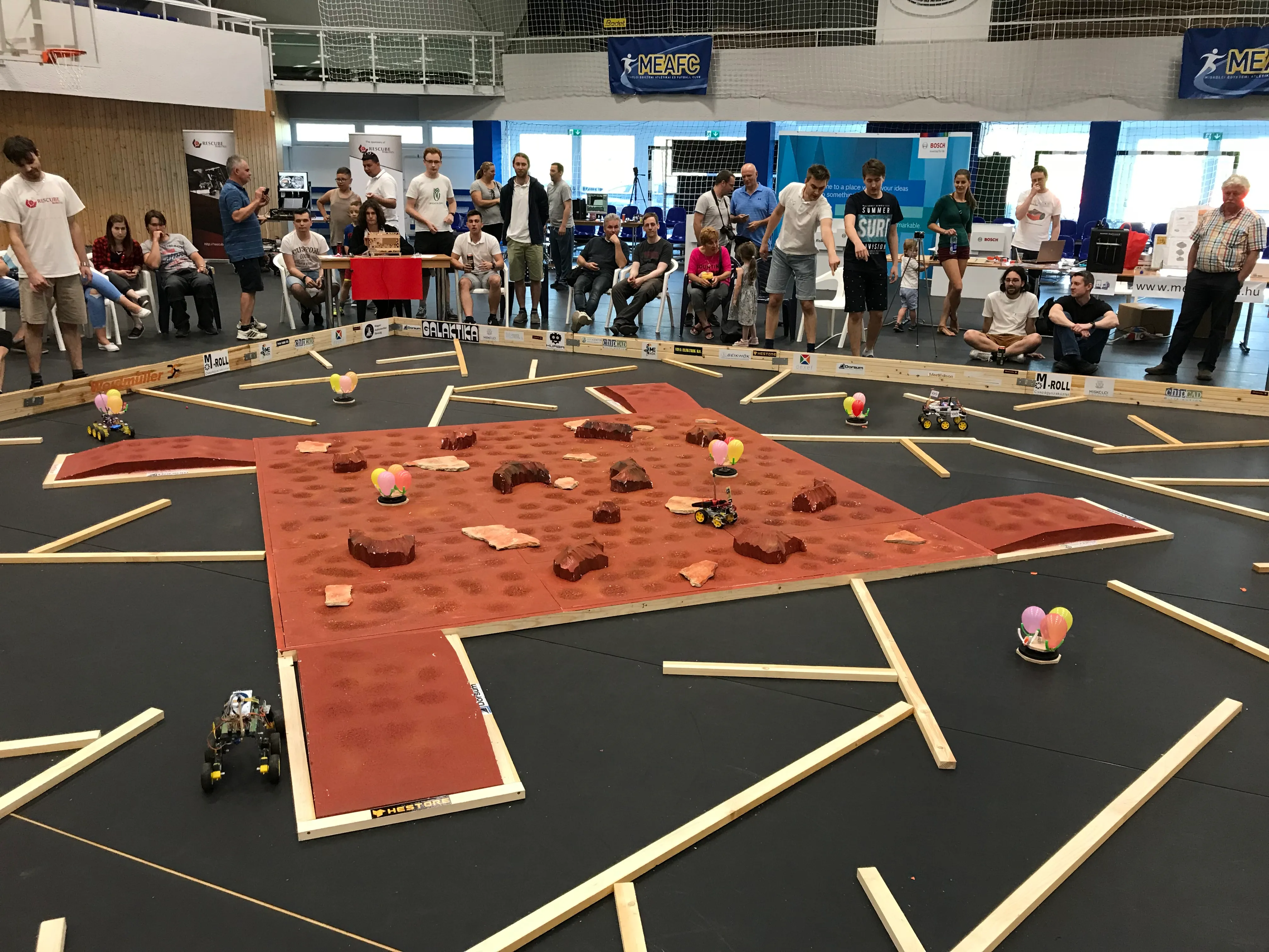 The whole course mid-mission, with balloon targets and rovers between the rocks