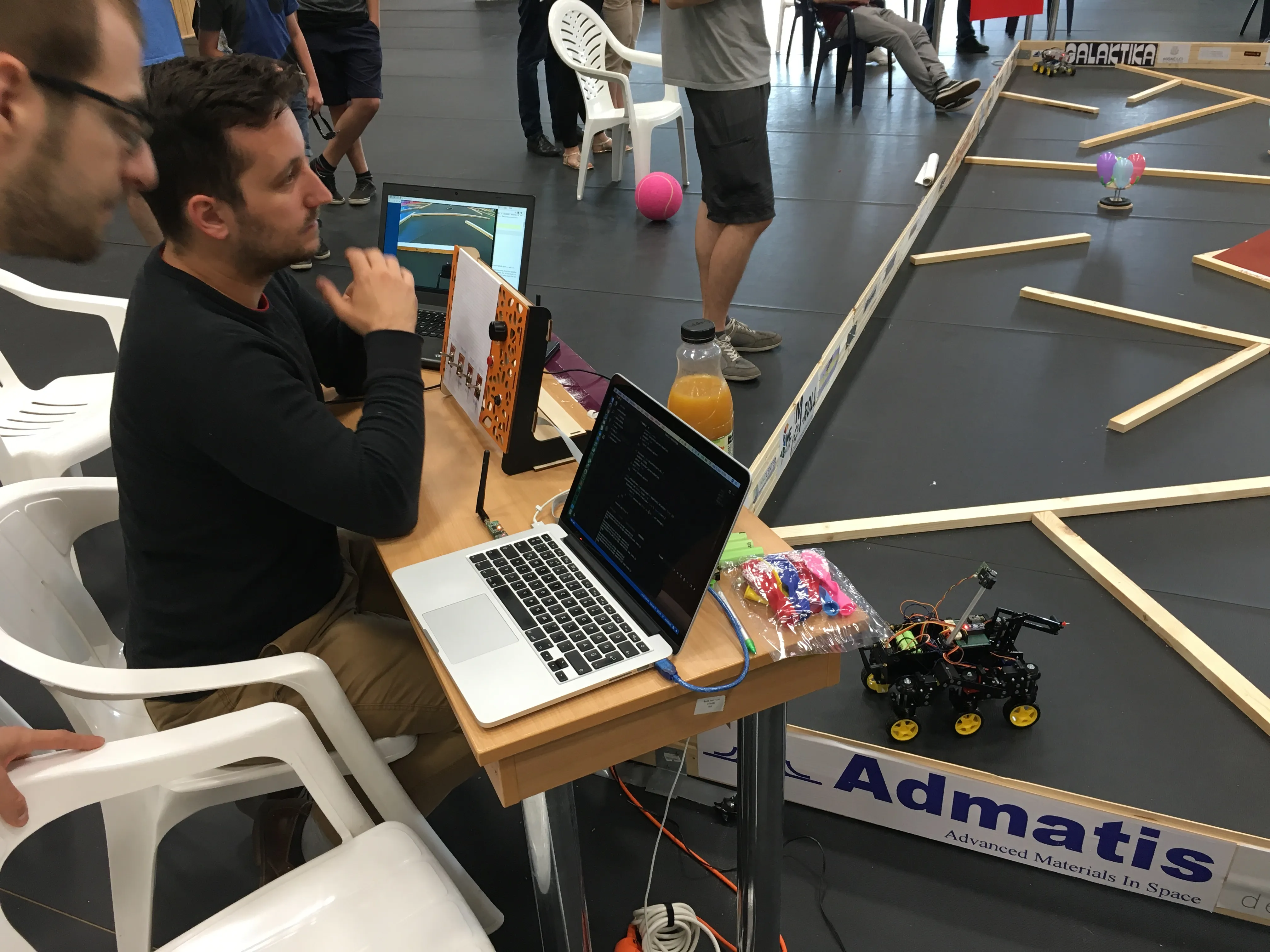 Our control desk during a run: the adaptive controller console and the camera feed on the laptops