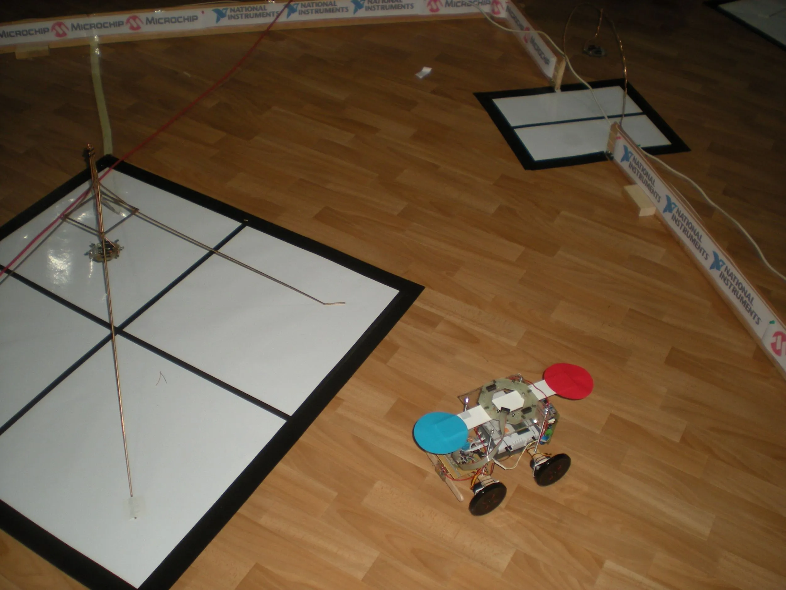 The rover carrying its red and blue discs on the course for easy identification from the overhead camera