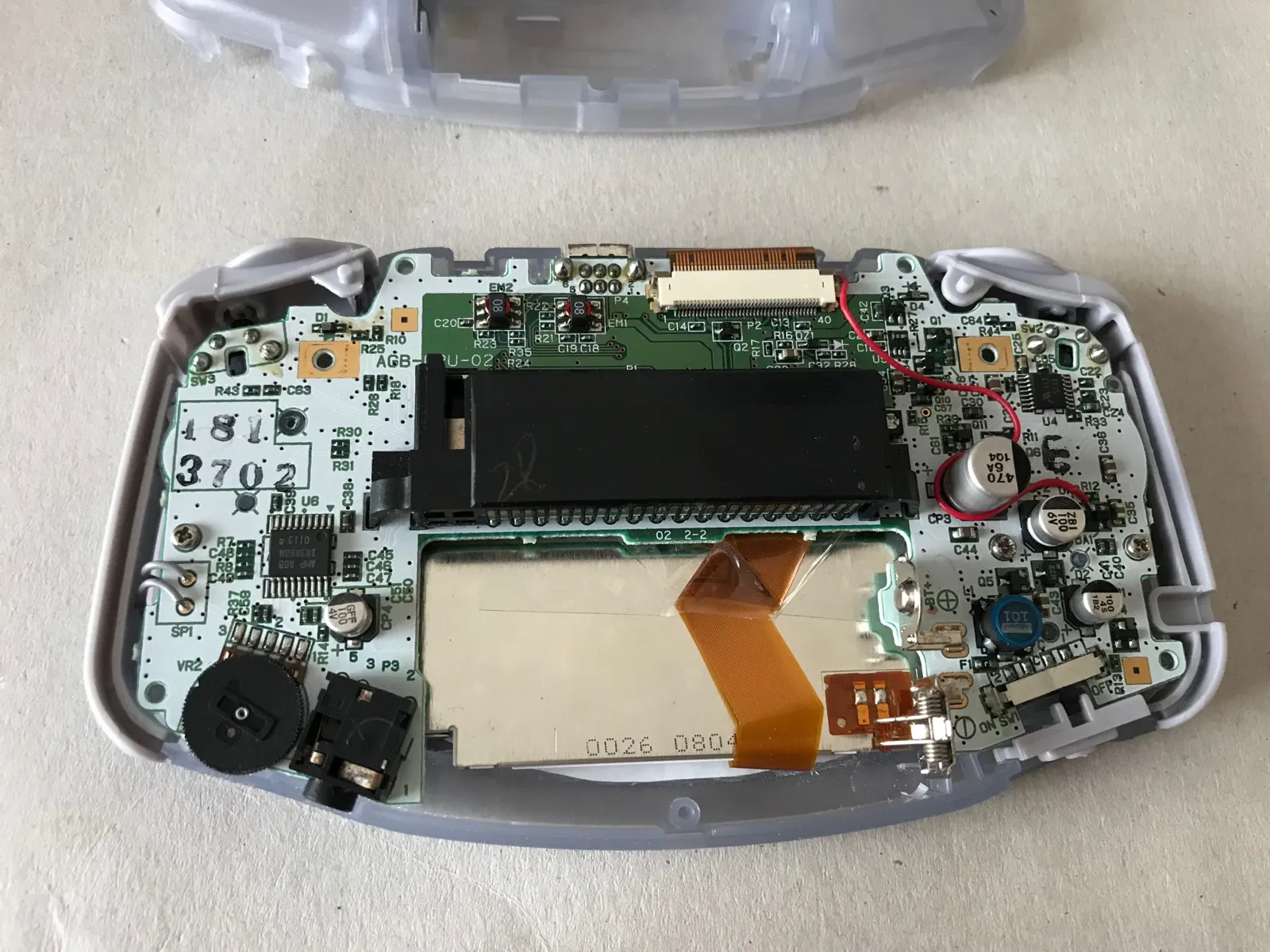 The red wire soldered onto the motherboard to power the backlight