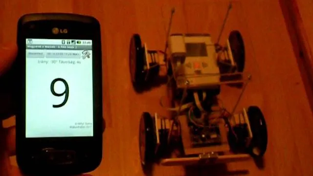 The phone running the ground station app next to the rover during a late night test